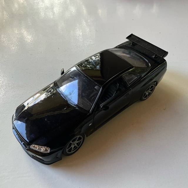 WELLY - NISSAN SKYLINE GT-R R34 Black 1:24